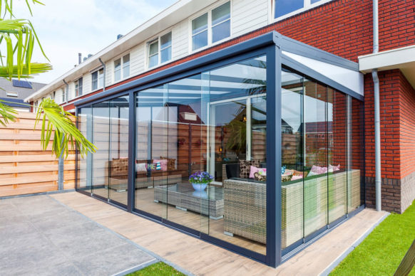 Aluminum pergola attached to house