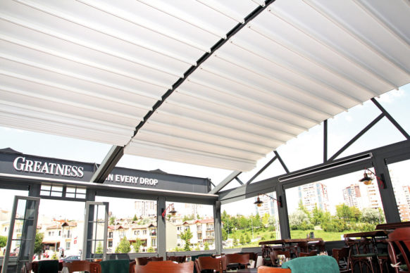 Attached Pergola with retractable canopy and curved roof