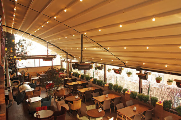 Attached Pergola with retractable canopy and curved roof